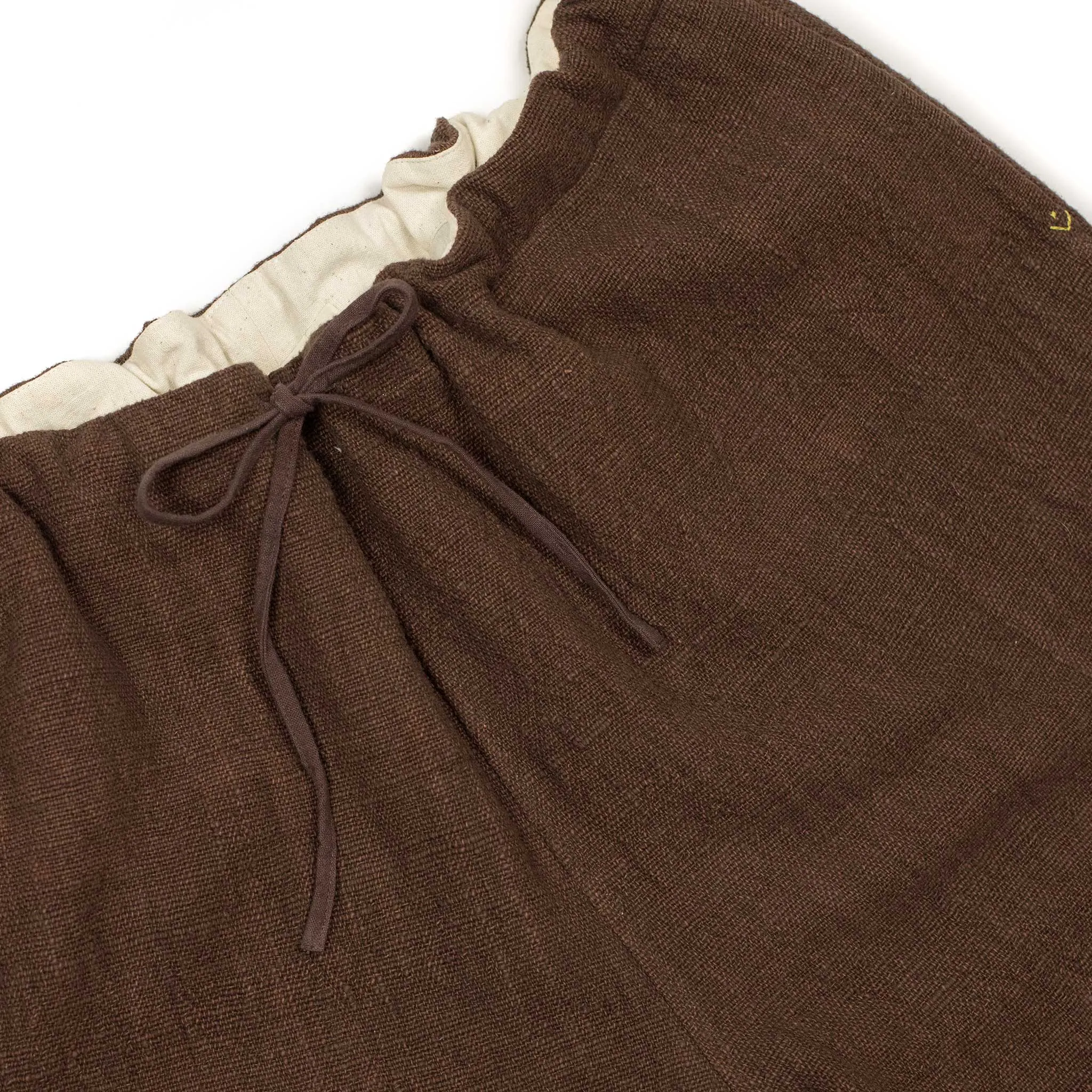 Drawstring tapered trousers in burnt umber cotton basketweave